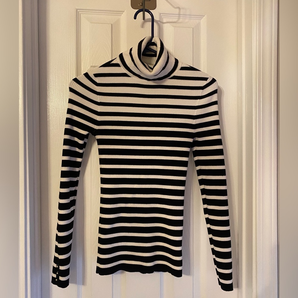 WHBM® Sculpted B&W Turtleneck with button detailed cuffs.